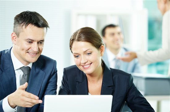 Five-star reviews collected through HBS online review solicitiation services put smiles on clients' faces like the man and woman pictured here looking at a laptop screen