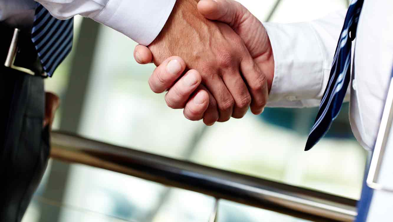 Legal Marketing NJ - Photo of two white men's hands shaking while they are wearing business attire